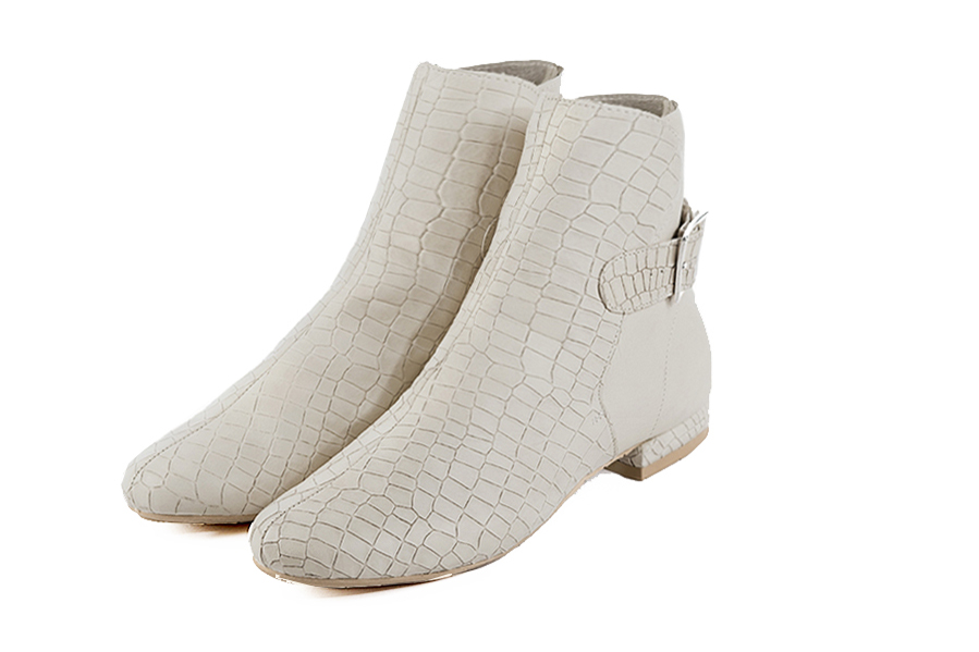 Off white women's ankle boots with buckles at the back. Round toe. Flat block heels. Front view - Florence KOOIJMAN